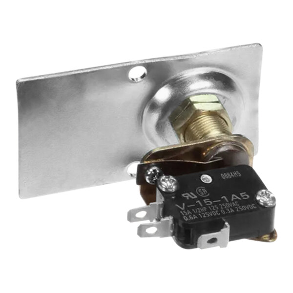 A metal plate with a black and gold switch.