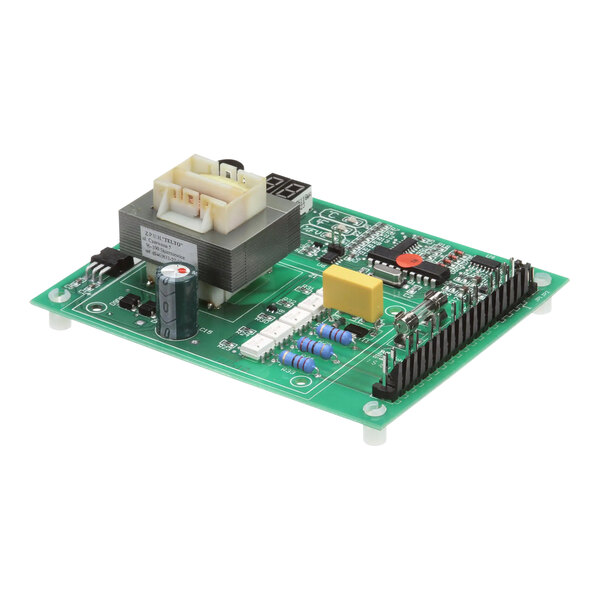 A close-up of a green Fetco control board with yellow rectangular components.