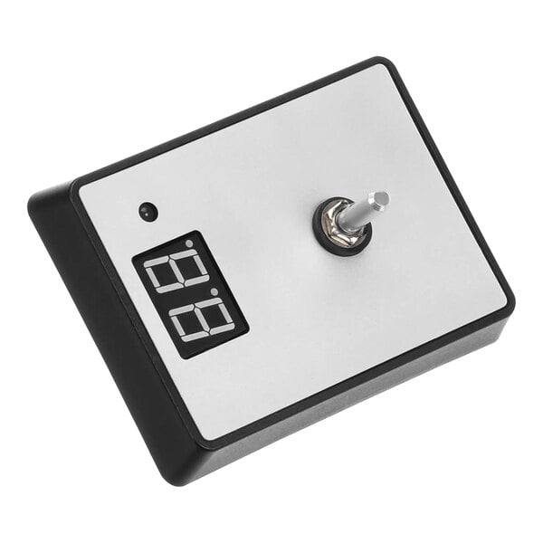A white and black digital timer with a metal knob.