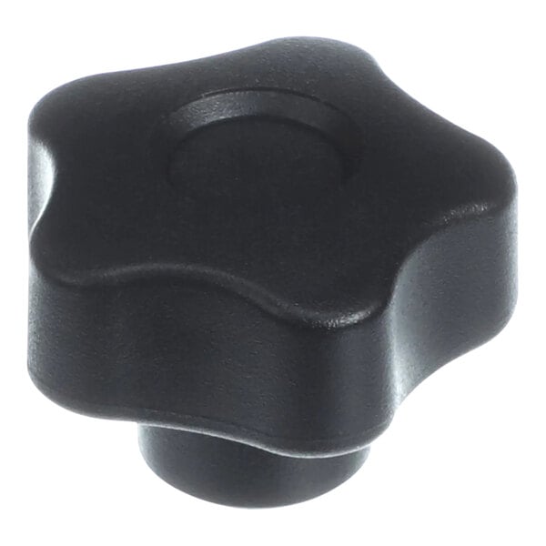 A close up of a black plastic star-shaped knob.