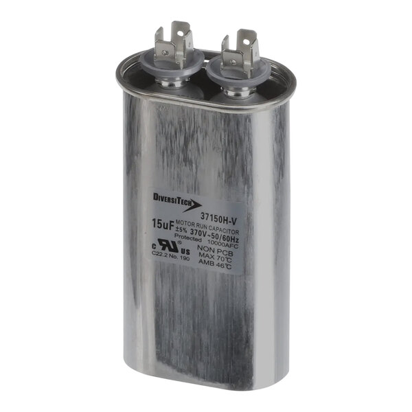 A close-up of a silver Lincoln 371197 metal capacitor with two wires.