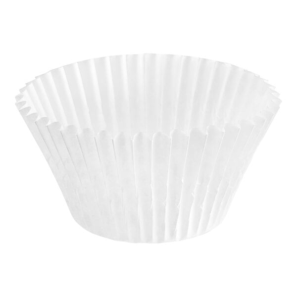 A close up of a white fluted paper cupcake liner.