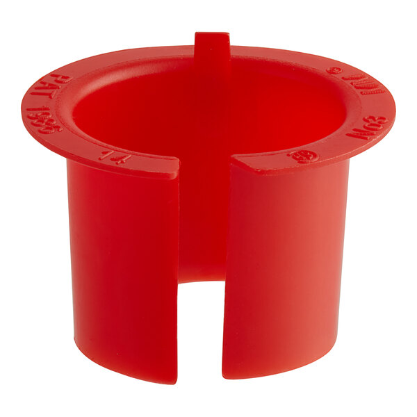 A red plastic ServIt conduit bushing on a counter.