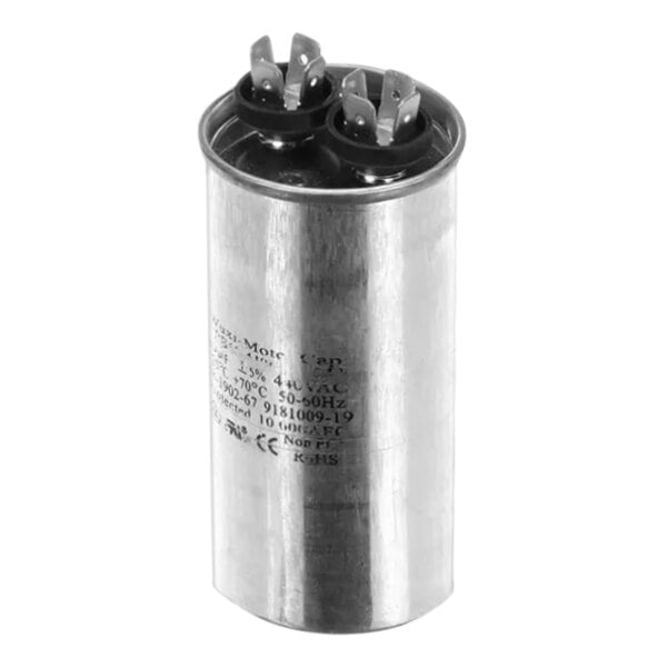 A close-up of a black and silver metal capacitor tube.