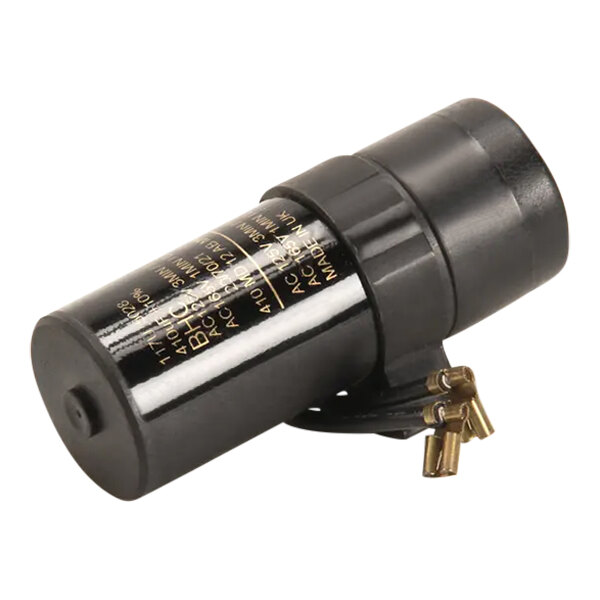 A black cylindrical capacitor with gold text.