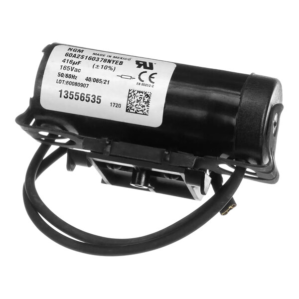 A black Scotsman capacitor start motor with a white label.