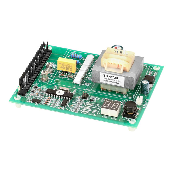 A green circuit board with many small electronic components.