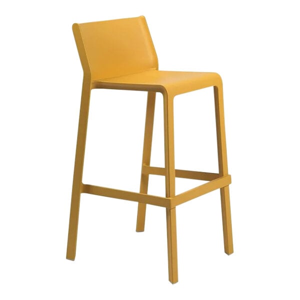 A yellow Nardi Trill Senape resin outdoor bar stool with wooden legs.