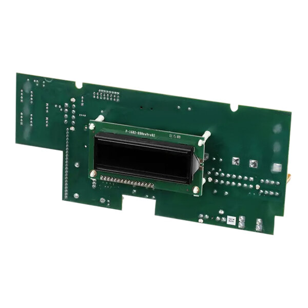 A green circuit board with a black rectangular object.