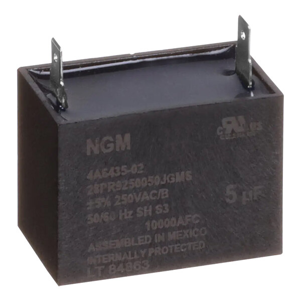 A black square Hoshizaki capacitor with metal corners and text on it.