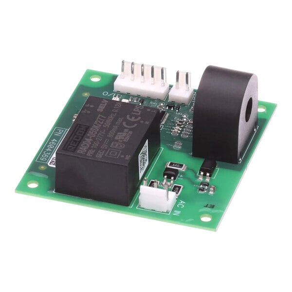 A close-up of a green circuit board with black and white components, including a black electronic device.