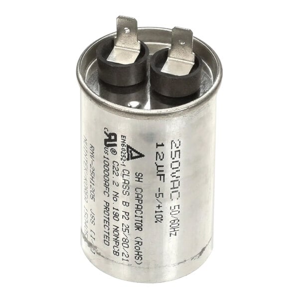 A close-up of a Turbo Air Refrigeration capacitor with black and grey caps.