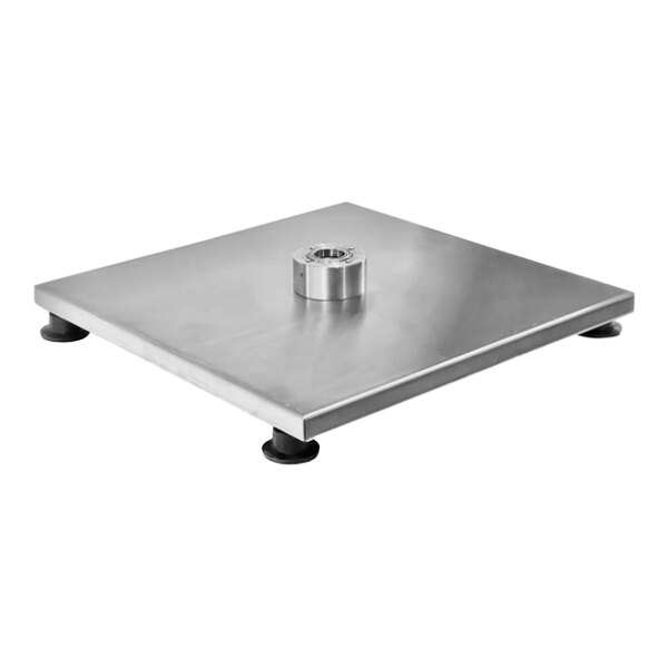 A stainless steel metal base for Inoksan vertical broilers on a table.