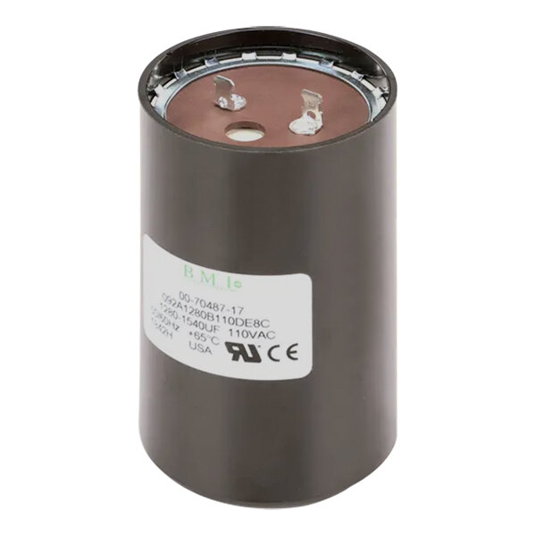 A round black Hobart capacitor with a white label.
