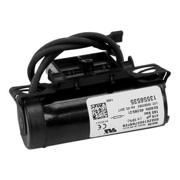 A True Refrigeration start capacitor with a white label on a black background.