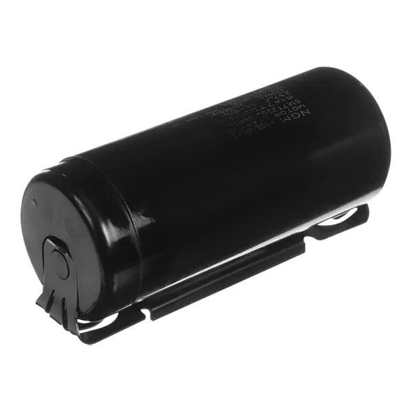 A black cylindrical capacitor with a clip on the lid.