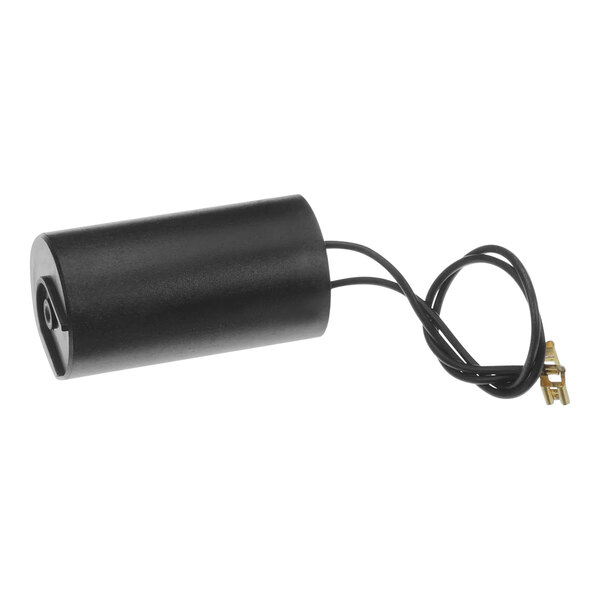 A black cylinder with a cord attached to it, a Hoshizaki start capacitor.