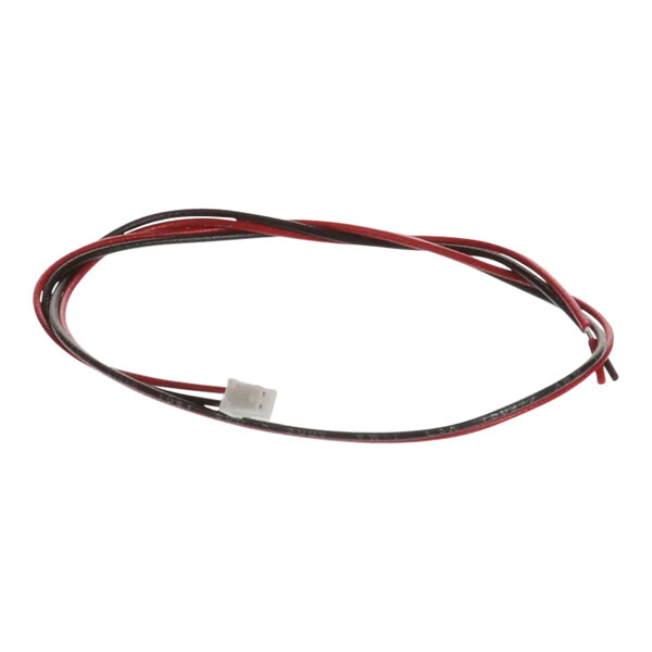 A close-up of a True Refrigeration LED input wire assembly containing red and black wires.