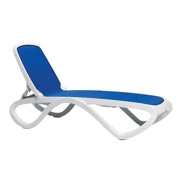 A white chaise lounge chair with blue accents.