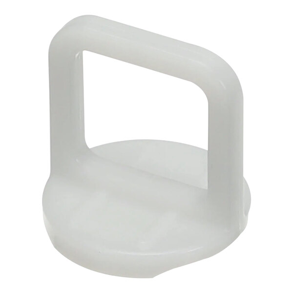 A white plastic object with a square handle.