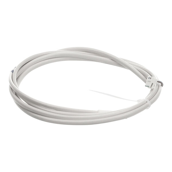 A close-up of a white cable with a white connector.