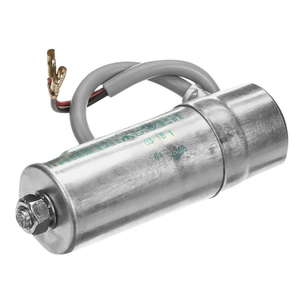 A silver metal cylinder with wires.