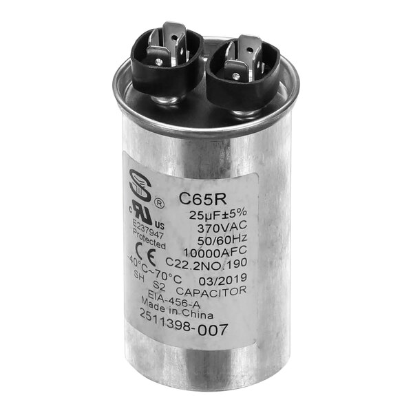 A round silver Spaceman capacitor with black and white text.