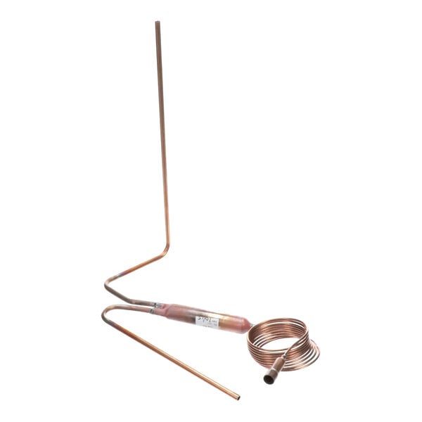 A copper cap tube with a filter attached to it.