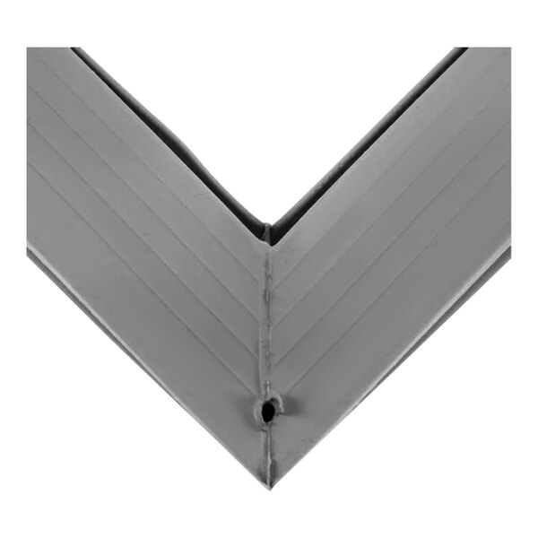 A gray metal corner with a small magnet inside.