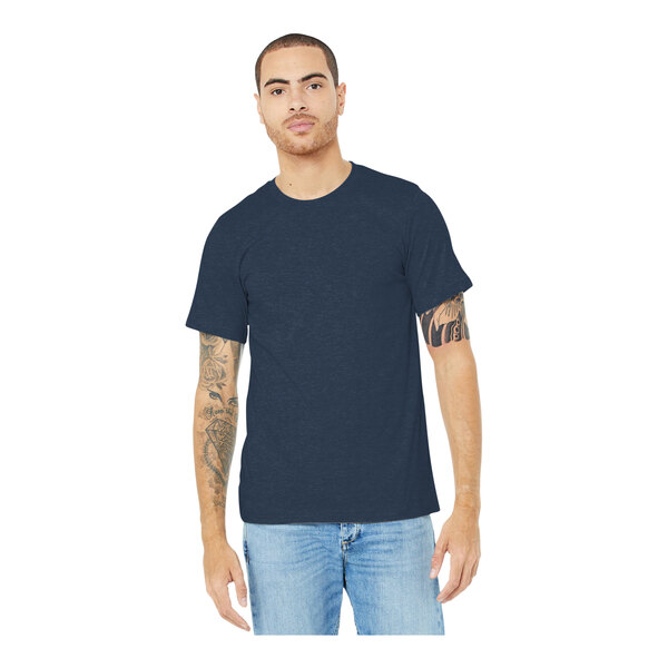 A man wearing a Bella + Canvas heather navy blue t-shirt.