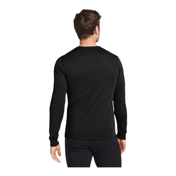 A man wearing a black Nike Dri-FIT long sleeve T-shirt.