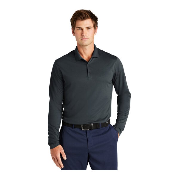 A man wearing a dark gray Nike short sleeve polo shirt.