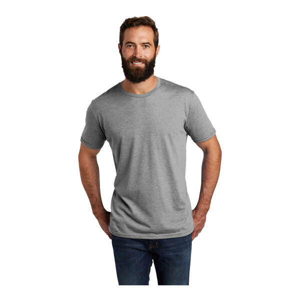 A man with a beard wearing a customizable gray AllMade aluminum T-shirt.