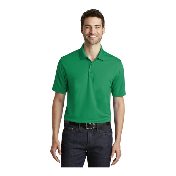 A man wearing a Port Authority bright kelly green polo shirt.