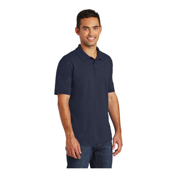 A man wearing a Port & Company deep navy polo shirt.