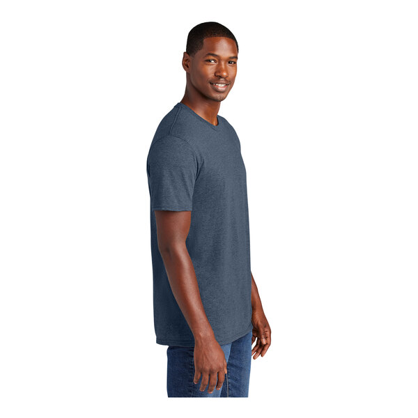 A man wearing a District Heathered Navy T-shirt.