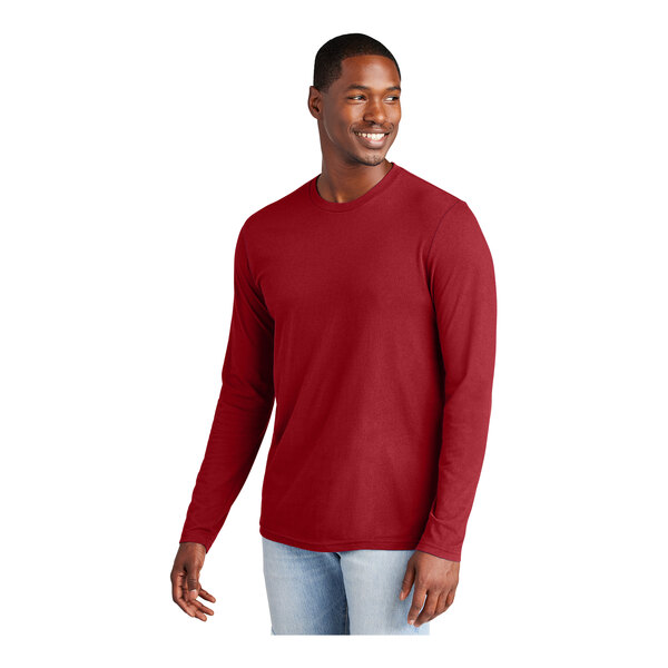 A man wearing a District red long sleeve t-shirt.
