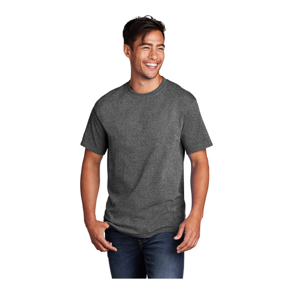 A man smiling and wearing a graphite heather Port & Company short sleeve t-shirt.