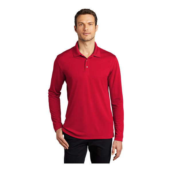 A man wearing a Port Authority long sleeve red polo shirt.