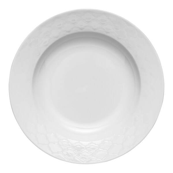 A close-up of a Libbey white porcelain soup bowl with a wide rim.