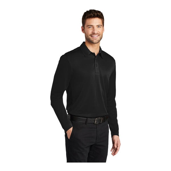 A man wearing a black Port Authority® long sleeve polo shirt.