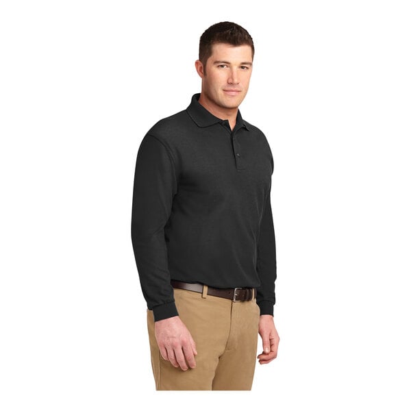 A man wearing a black Port Authority® long sleeve polo shirt.