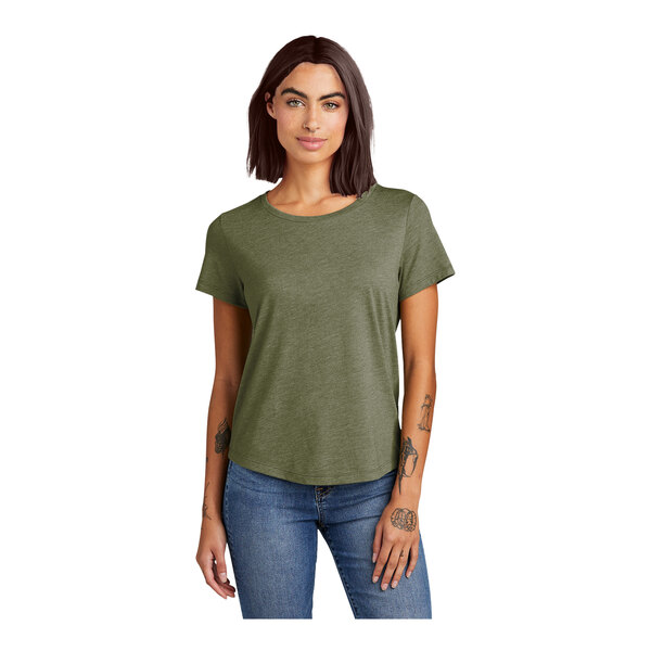 An olive green women's short sleeve tee with a scoop neck on a woman with tattoos.