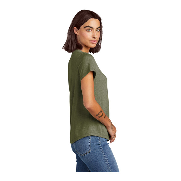 A woman wearing an olive green AllMade Tri-Blend short sleeve tee.