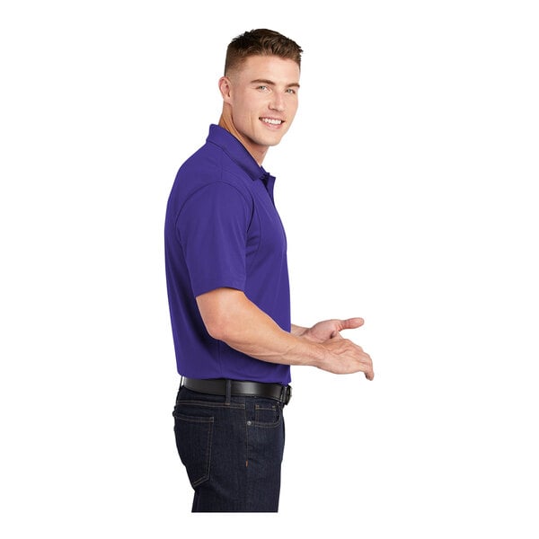 A man in a purple Sport-Tek short sleeve polo.