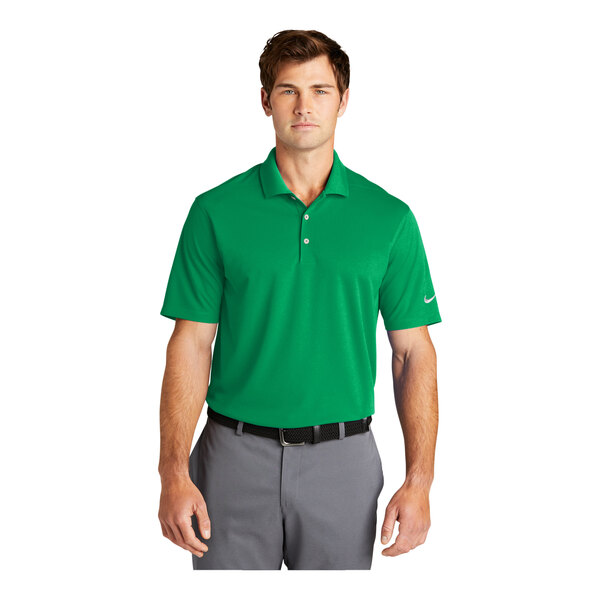 A man wearing a green Nike Dri-Fit polo.