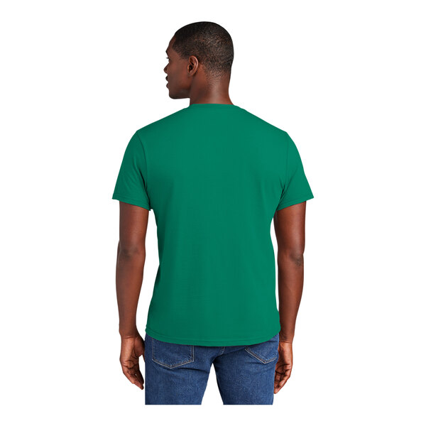 A man wearing a District Jewel Green short sleeve T-shirt.