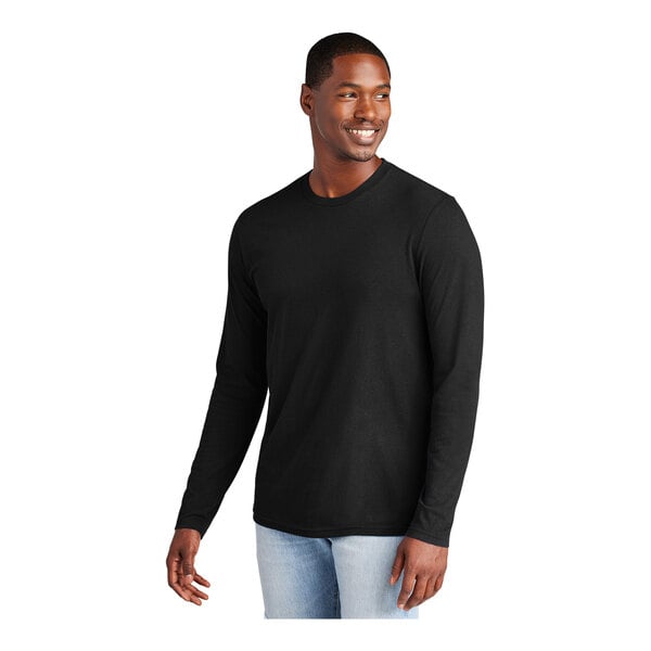 A black man wearing a District long sleeve black shirt.