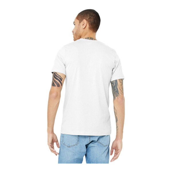 A man wearing a Bella + Canvas white combed ring-spun cotton / poly blend T-shirt and jeans.