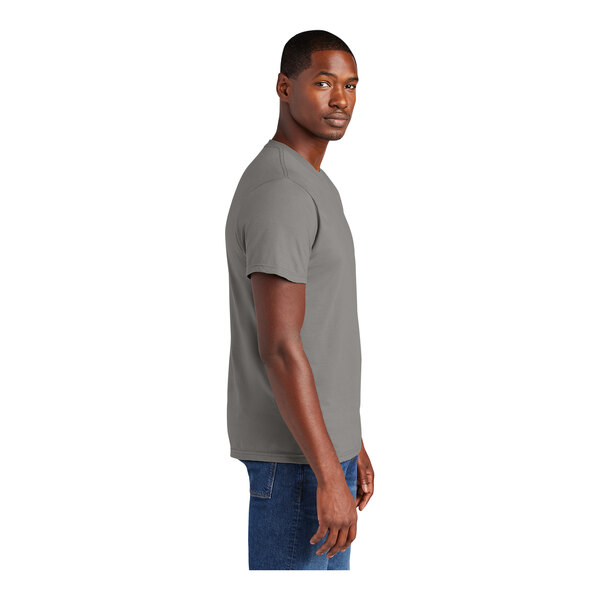 A person wearing a District grey short sleeve t-shirt.